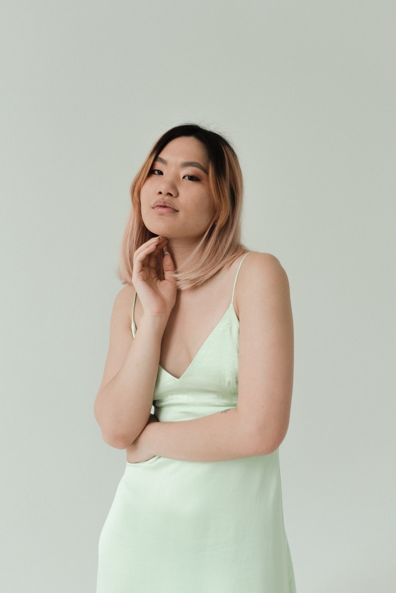 a young woman in mint dress