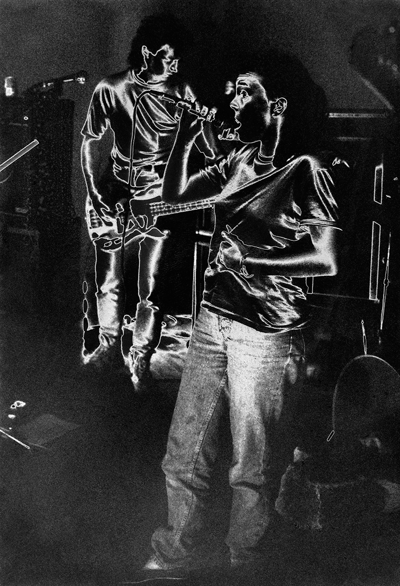 a solarized surreal photo of musicians