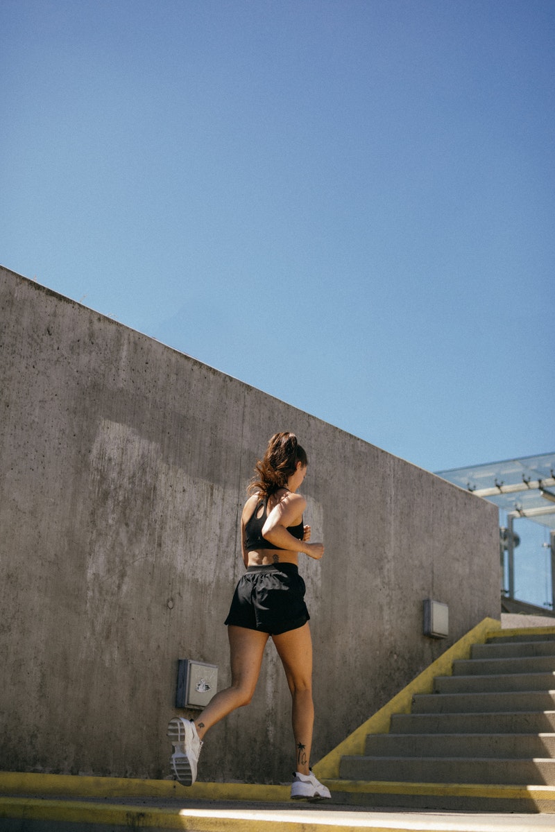 a woman jogging on the street