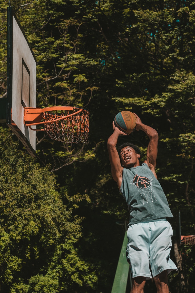 a basketball player scoring a goal