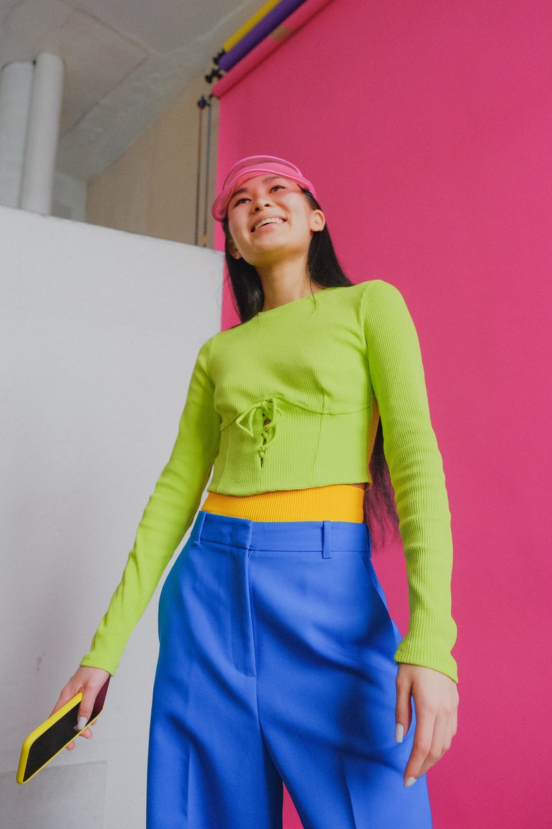 a young woman in bright outfit