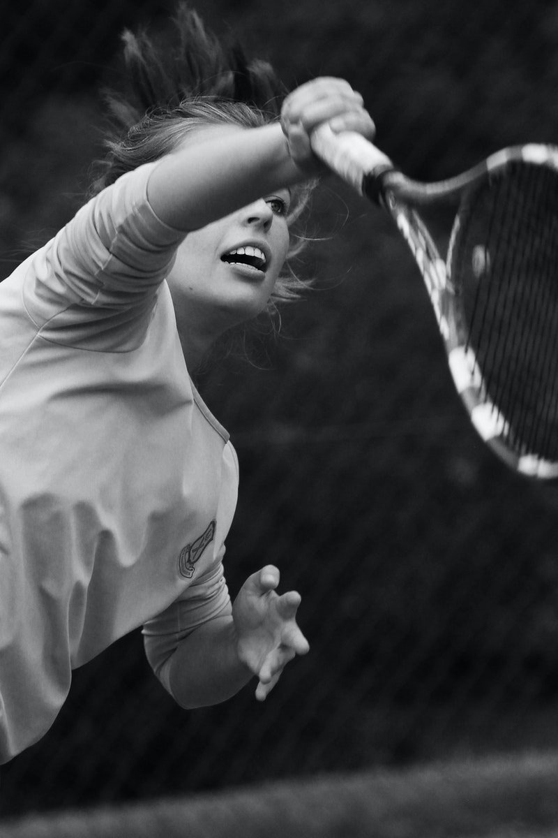 a black-and-white photo of a woman tennis player