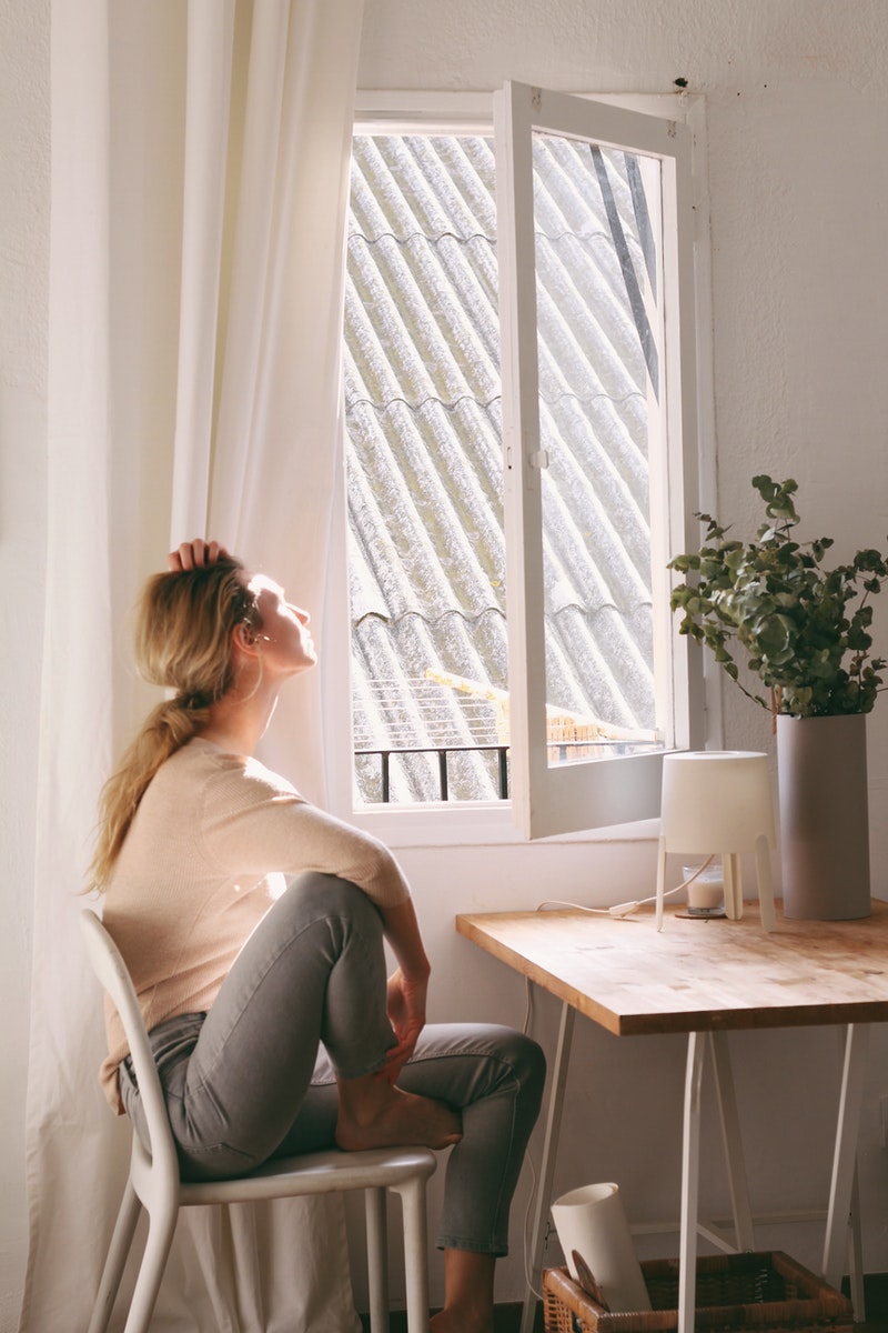 a young woman being cozy in her home