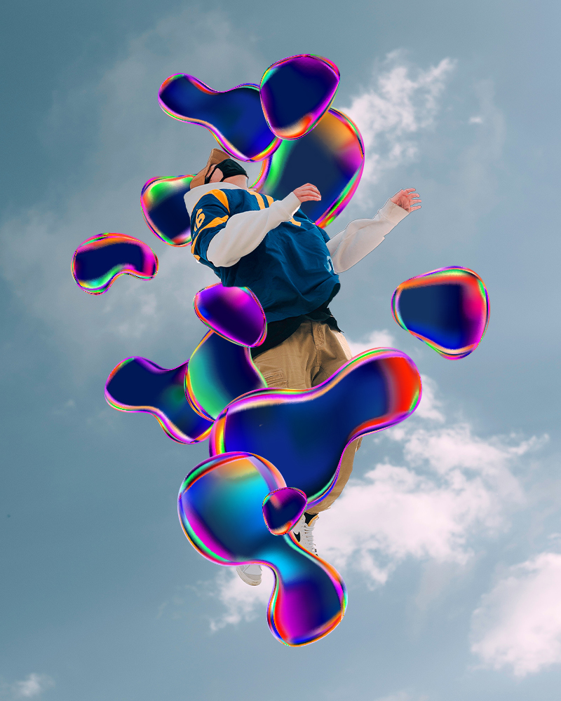 A surreal holographic shapes on a sky background