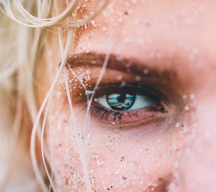 ocean waves in the blond woman’s eyes