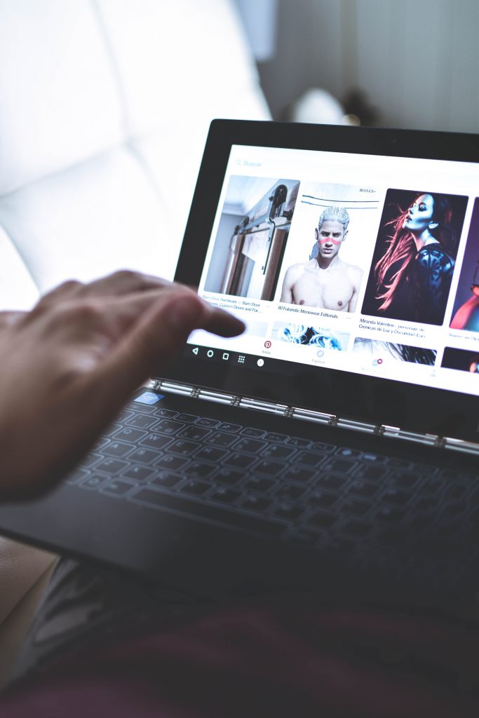 Person using Pinterest on a laptop