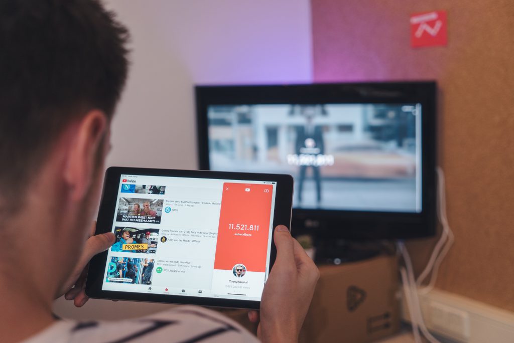 Person watching YouTube on a tablet